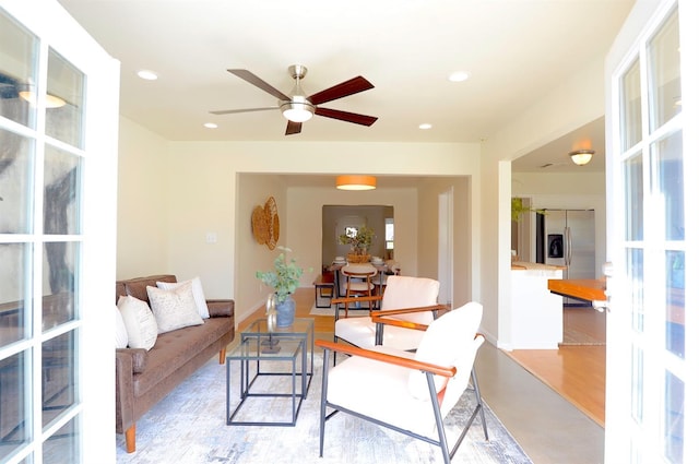 interior space with light wood-style flooring, recessed lighting, baseboards, and ceiling fan