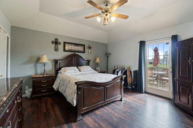 bedroom featuring dark wood-style floors, vaulted ceiling, a ceiling fan, and access to outside