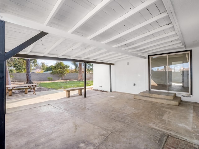 view of patio featuring entry steps and fence