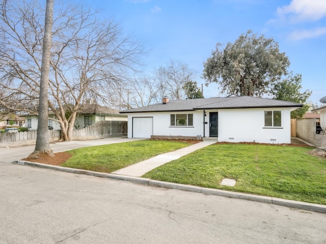 single story home with concrete driveway, an attached garage, fence, and a front yard