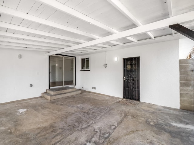 entrance to property featuring stucco siding, a patio area, and crawl space