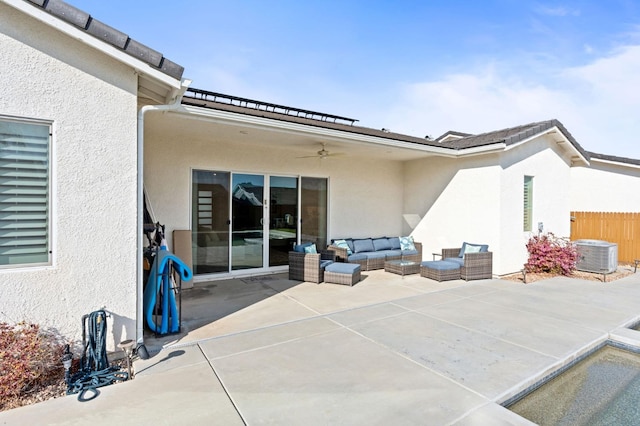 view of patio / terrace with outdoor lounge area, central AC unit, a ceiling fan, and fence