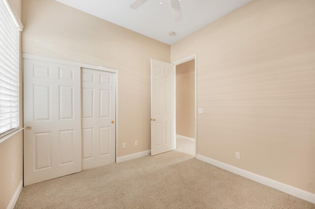 2565 Powers Ave, Clovis, CA 93619 - unfurnished bedroom with a closet, carpet, multiple windows, and baseboards