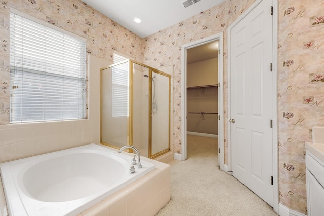 2565 Powers Ave, Clovis, CA 93619 - bathroom featuring a shower stall, a bath, wallpapered walls, and baseboards