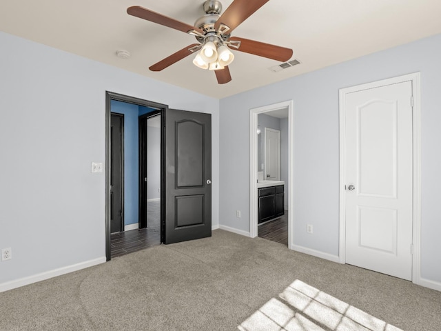 unfurnished bedroom featuring baseboards, visible vents, and carpet floors