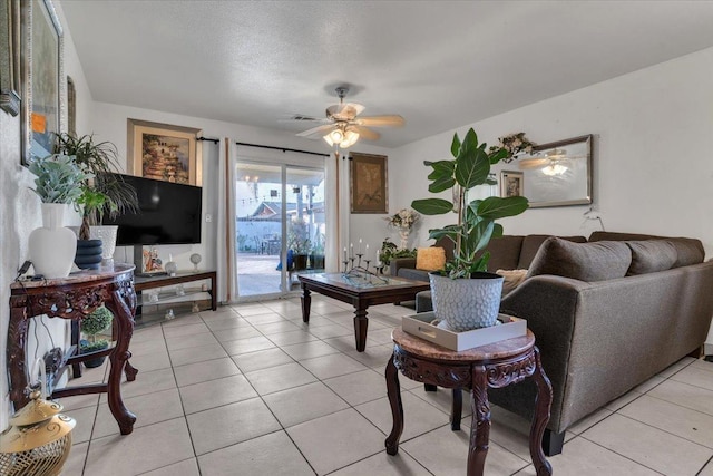 living room with light tile patterned flooring and a ceiling fan