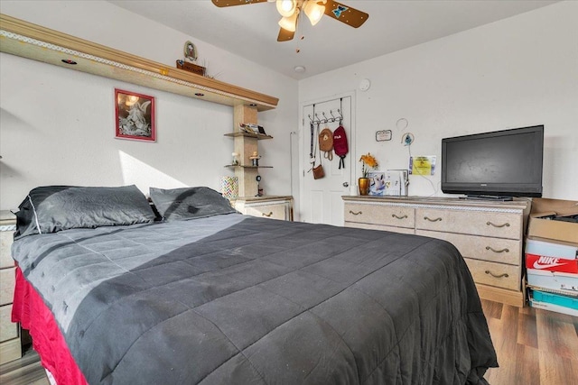 bedroom featuring a ceiling fan and wood finished floors