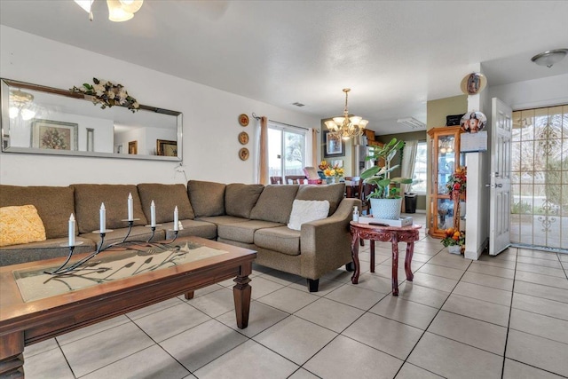 living room featuring an inviting chandelier and light tile patterned floors