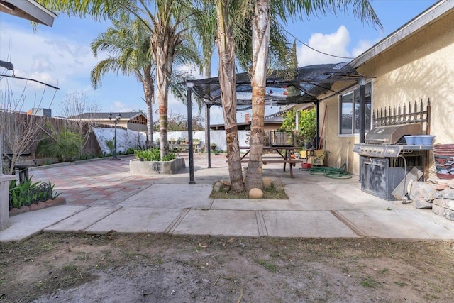 view of patio featuring a fenced backyard and grilling area