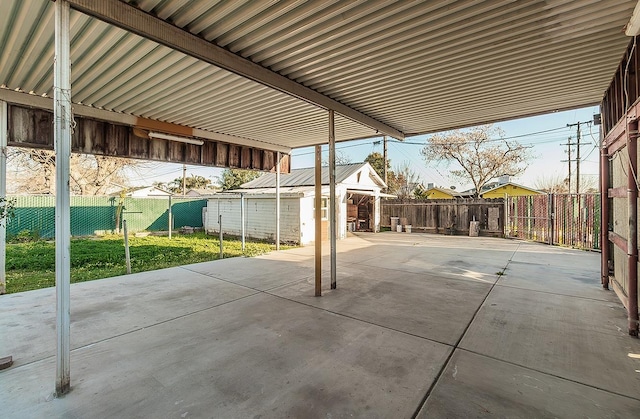 view of patio featuring an outbuilding and a fenced backyard