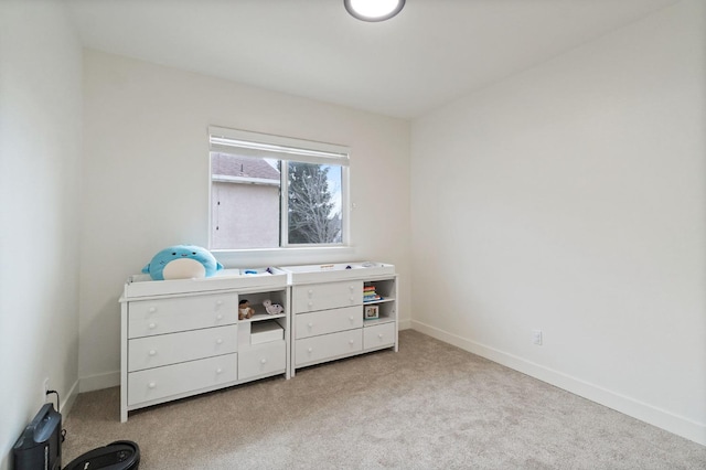 carpeted bedroom featuring baseboards