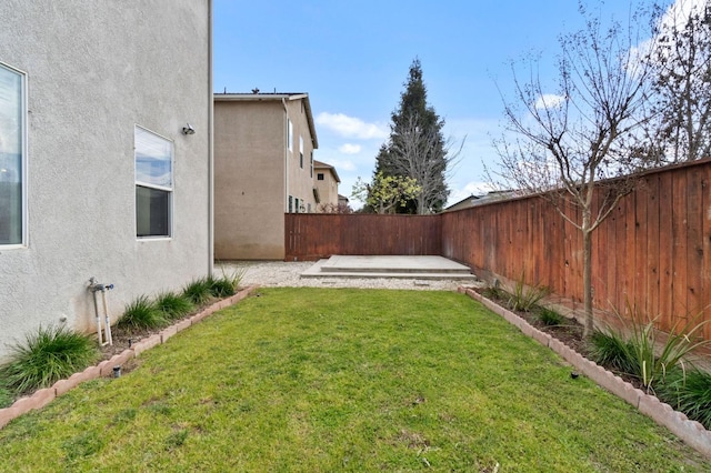 view of yard featuring a patio area and a fenced backyard