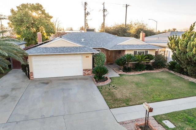 ranch-style home featuring brick siding, concrete driveway, a front yard, and roof with shingles