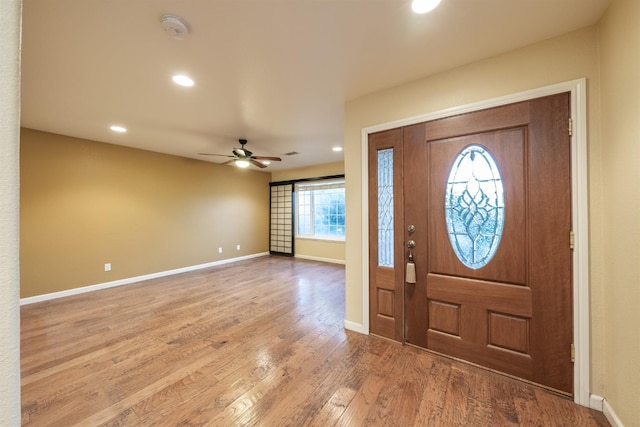 foyer entrance with recessed lighting, wood finished floors, baseboards, and ceiling fan