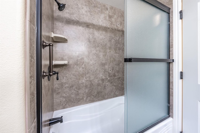 full bathroom with shower / bath combination with glass door