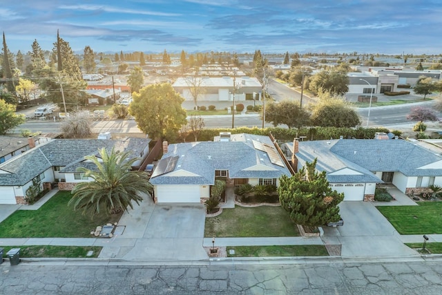 birds eye view of property with a residential view