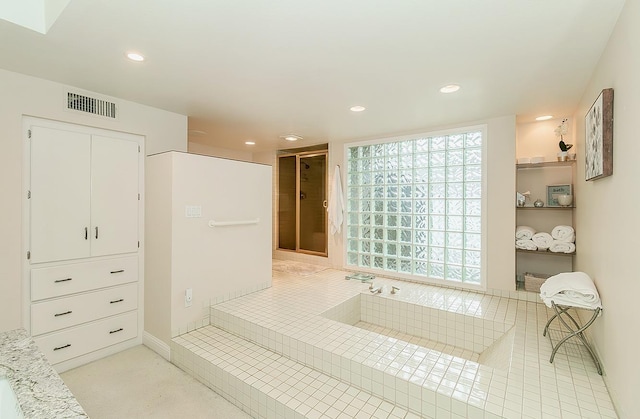 bathroom with recessed lighting, visible vents, and a shower stall