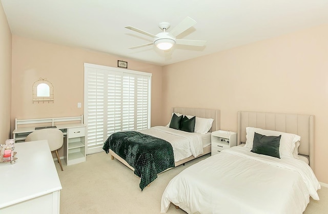 carpeted bedroom with a ceiling fan