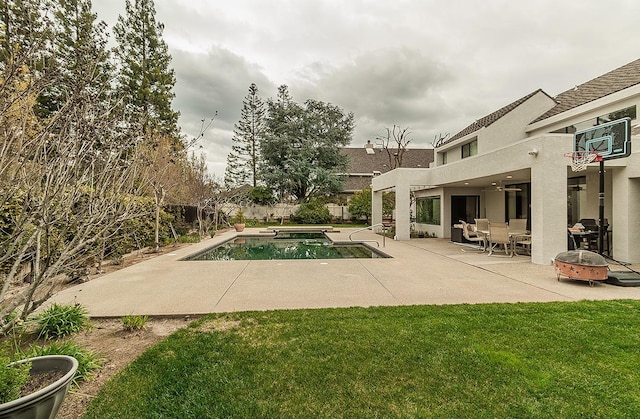 view of pool with fence, an outdoor fire pit, a yard, a fenced in pool, and a patio area