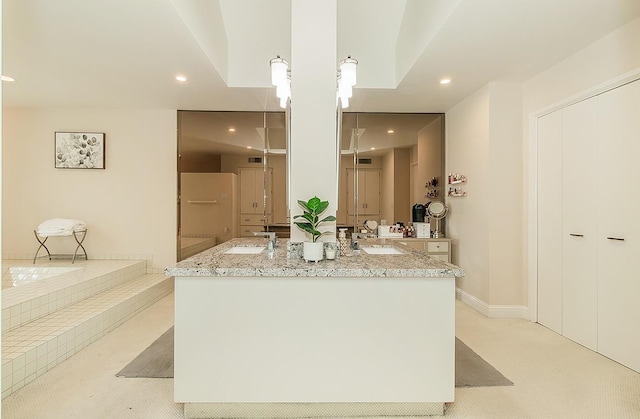 full bathroom with vanity, visible vents, a bathing tub, baseboards, and recessed lighting