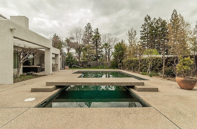 view of pool featuring outdoor lounge area, a patio, a fenced backyard, and a fenced in pool