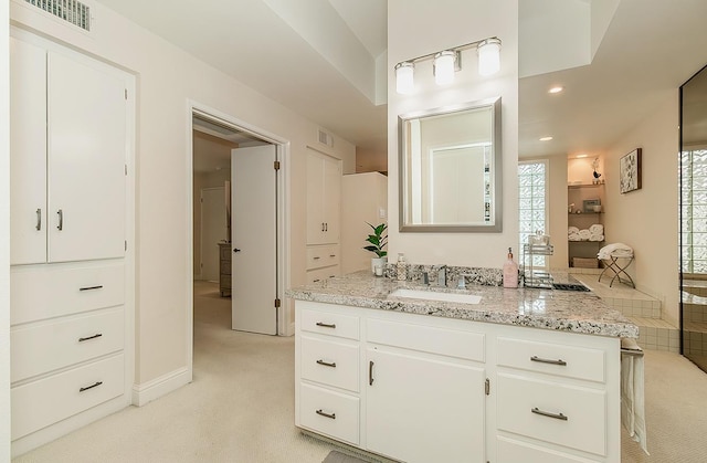 bathroom with visible vents, recessed lighting, and vanity