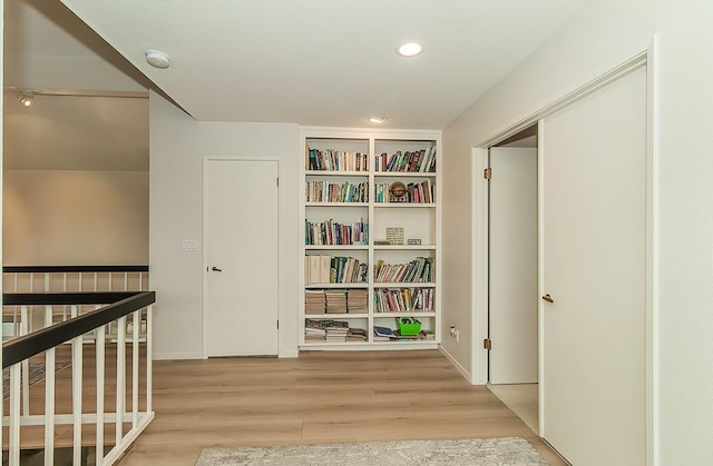 hallway with recessed lighting and wood finished floors