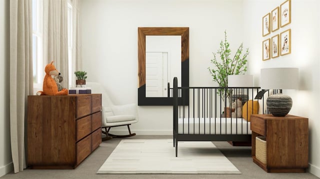 carpeted bedroom featuring baseboards