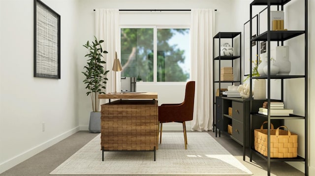 sitting room featuring carpet and baseboards