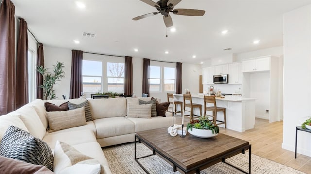 1158 Granite Dr W Unit 66, Madera, CA 93636 - living area with light wood-style flooring, a ceiling fan, and recessed lighting