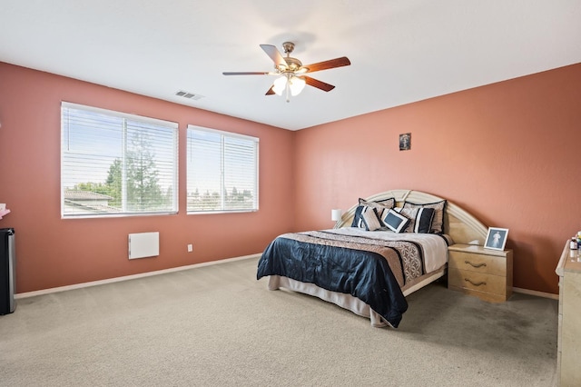 bedroom featuring visible vents, baseboards, carpet, and ceiling fan