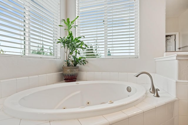 bathroom with a whirlpool tub