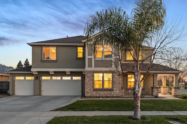 1410 Azalea St, Kingsburg, CA 93631 - view of front of property with stucco siding, stone siding, concrete driveway, and a lawn