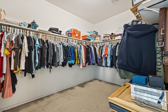 spacious closet with visible vents and carpet floors