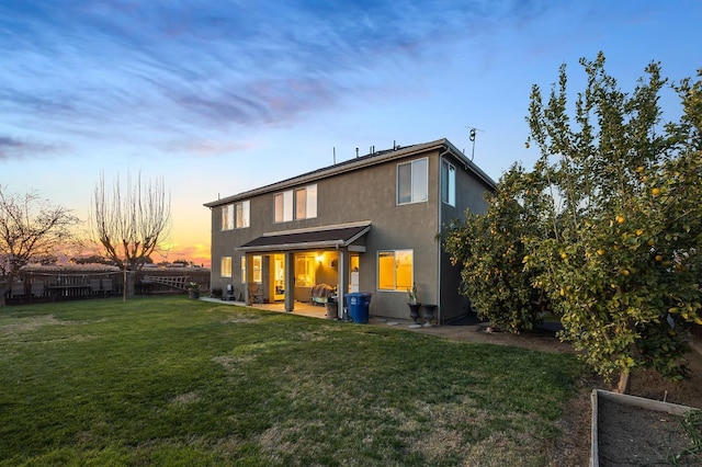 1410 Azalea St, Kingsburg, CA 93631 - back of house with stucco siding, a fenced backyard, and a patio