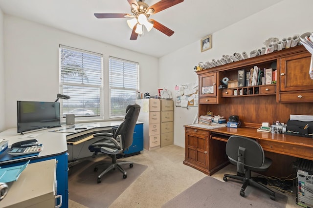 office area featuring light carpet and ceiling fan