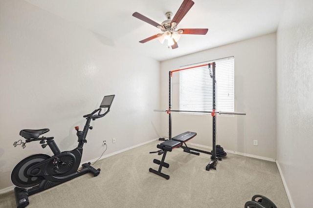 workout room featuring baseboards, ceiling fan, and carpet flooring