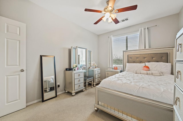 bedroom with visible vents, light carpet, baseboards, and a ceiling fan