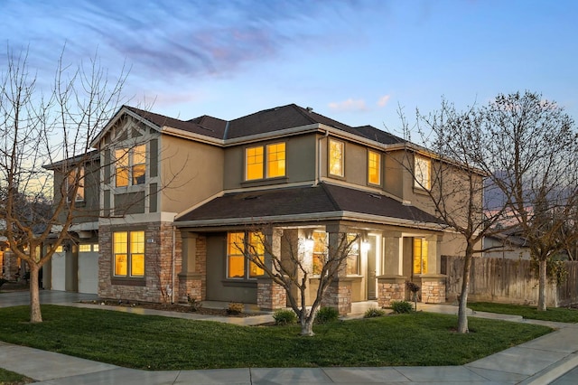 1410 Azalea St, Kingsburg, CA 93631 - view of front facade with stone siding, stucco siding, a garage, and driveway