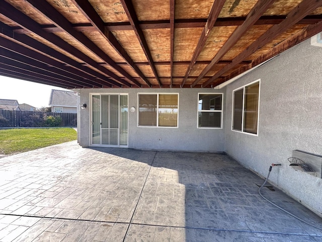 view of patio / terrace featuring fence