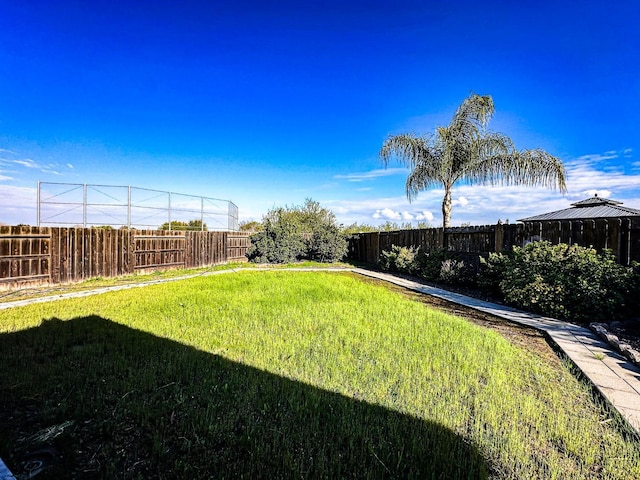 view of yard with a gazebo and a fenced backyard