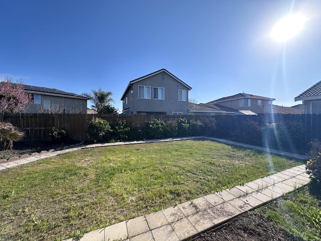 exterior space with a fenced backyard