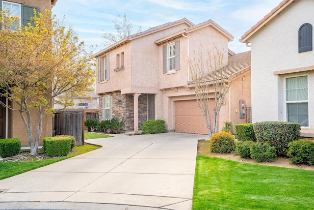 view of front of home featuring stucco siding, a garage, driveway, and a tiled roof