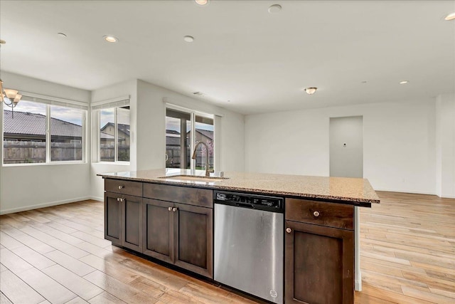 kitchen featuring a sink, recessed lighting, light wood finished floors, dark brown cabinets, and dishwasher