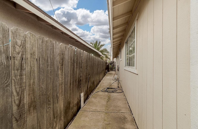 view of side of home with fence