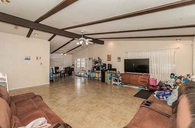 living area with lofted ceiling with beams, a ceiling fan, and baseboards