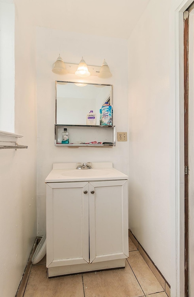 bathroom with tile patterned floors and vanity