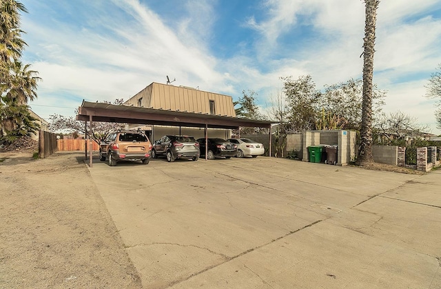 covered parking lot with fence