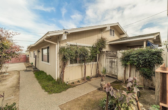 view of property exterior with a patio and a fenced backyard