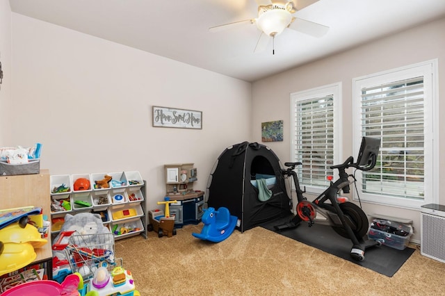 game room with ceiling fan and carpet